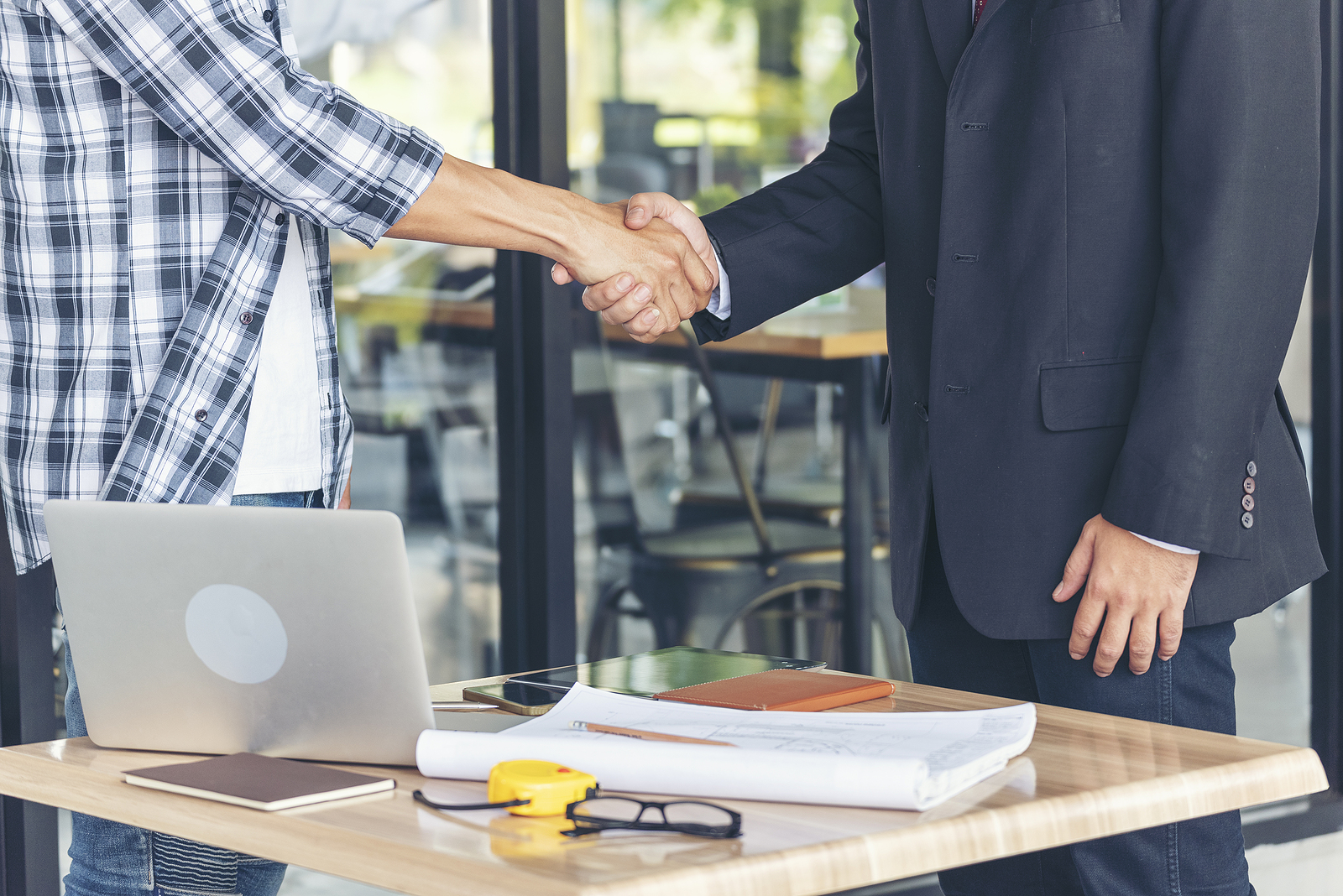 Employer & Candidate Shaking Hands After Agreeing to Contract Jobs